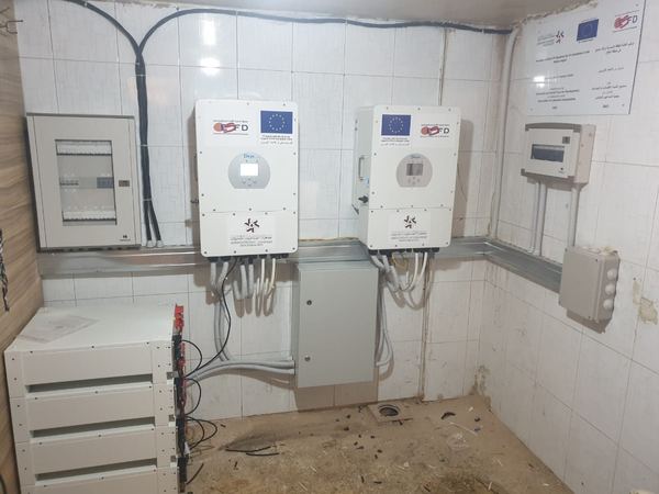 Inverters and batteries in a tiled room