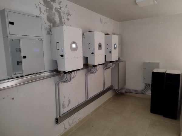 Row of hybrid inverters on the wall